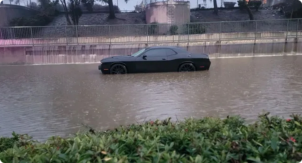 car in flooded street